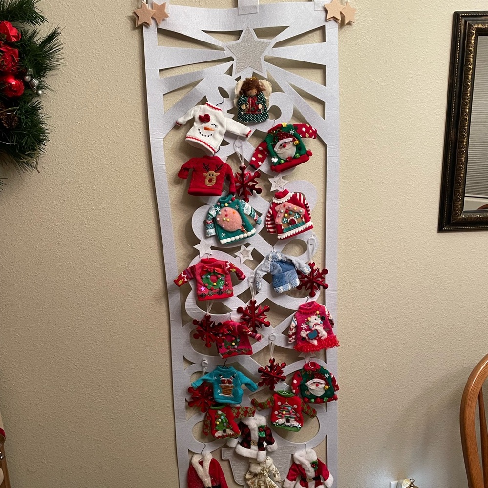 Hanging white Christmas tree w/ sweaters, snowflakes, red star, beige felt stars